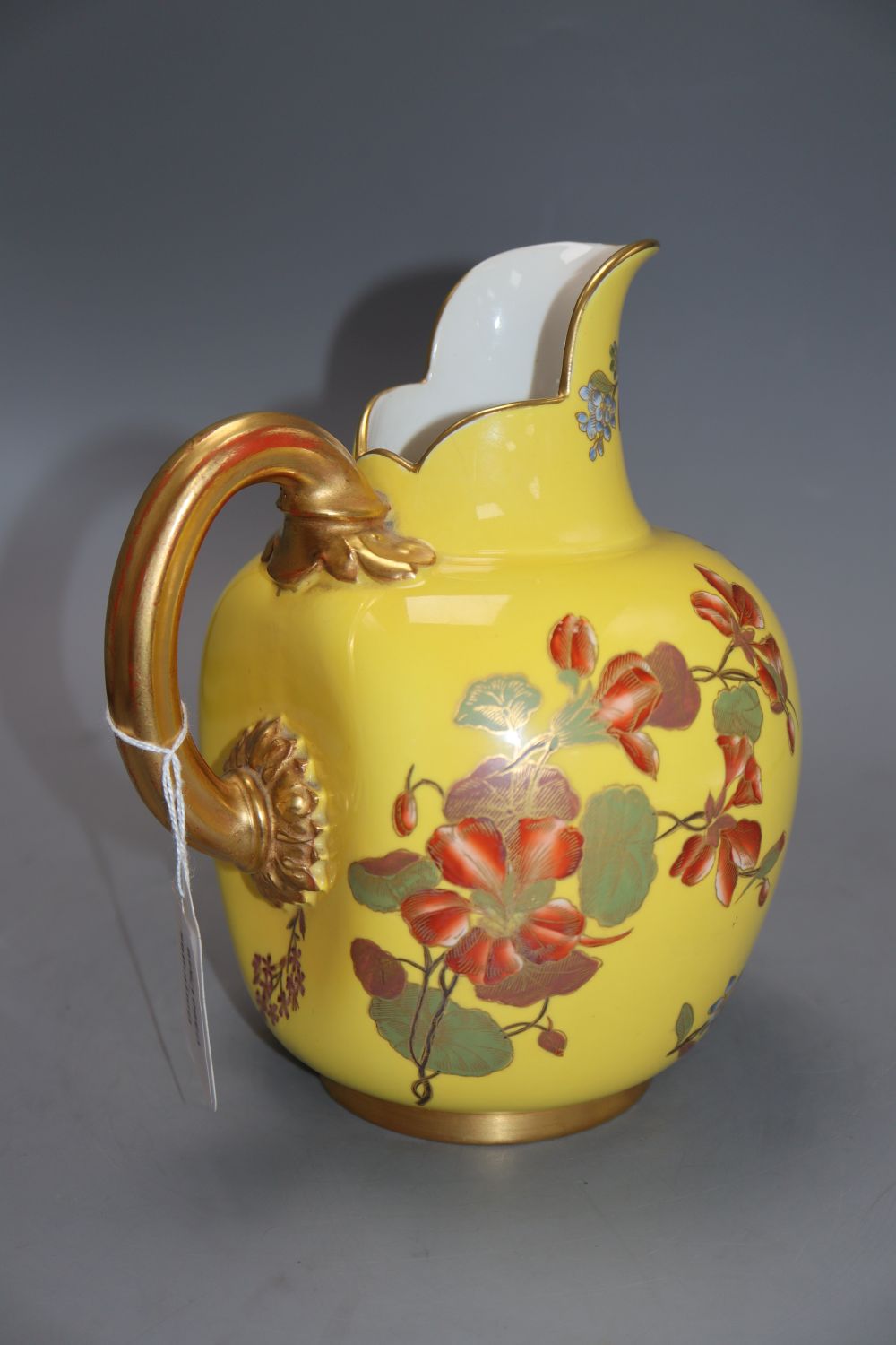 A Royal Worcester yellow ground jug, height 21cm